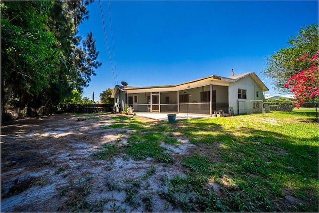 4424 Regency Dr, Lake Worth, FL 33461 - back of property featuring a sunroom