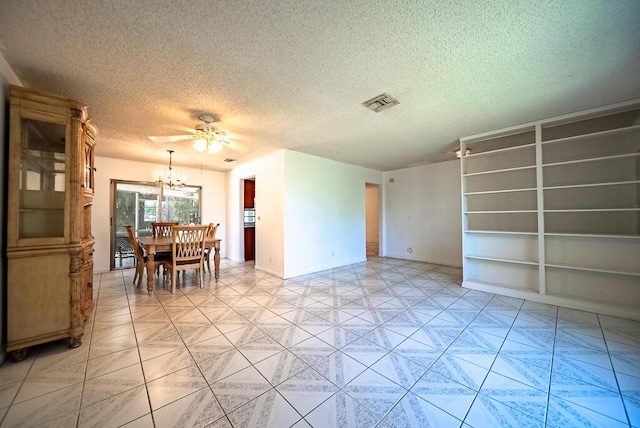 4424 Regency Dr, Lake Worth, FL 33461 - dining room with a textured ceiling, a chandelier, built in shelves, ceiling fan, and baseboards