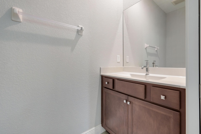 4982 SE Railway Ave, Stuart, FL 34997 - bathroom featuring vanity and a textured wall