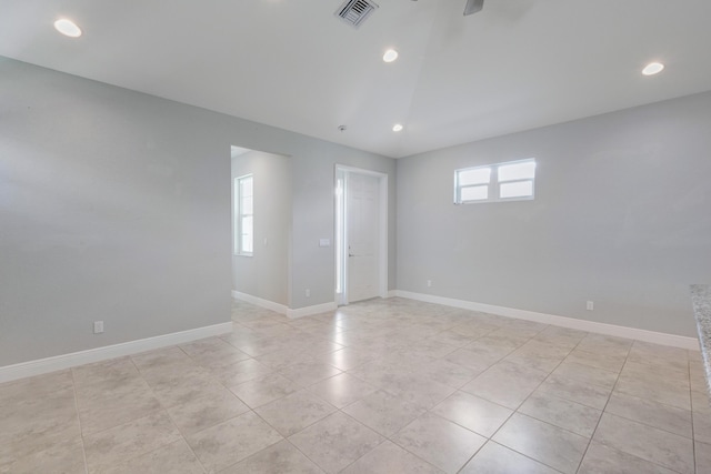 4982 SE Railway Ave, Stuart, FL 34997 - spare room featuring light tile patterned floors, baseboards, and recessed lighting