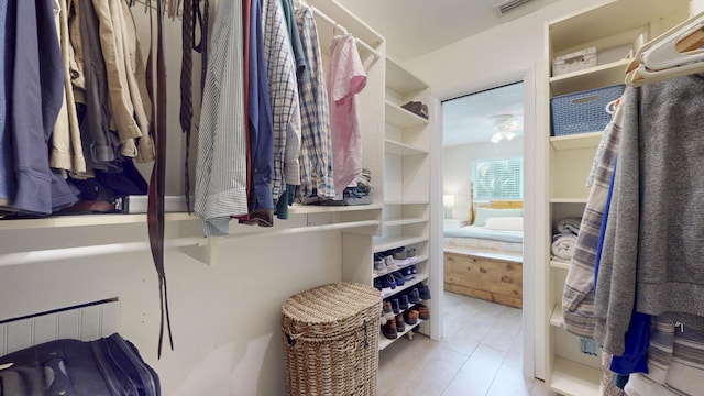 spacious closet featuring ceiling fan