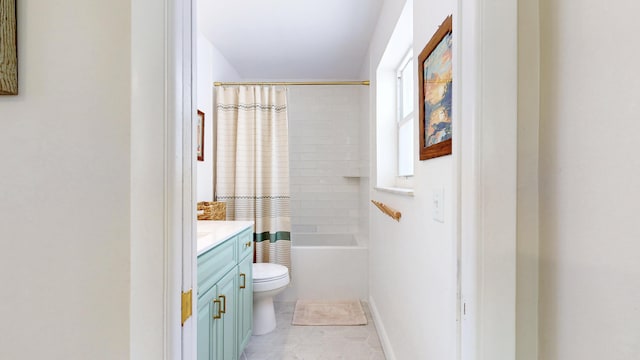bathroom with vanity, toilet, and shower / tub combo with curtain