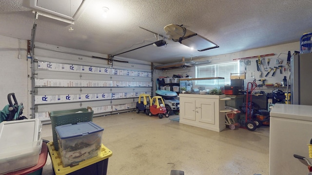 garage featuring a garage door opener and freestanding refrigerator