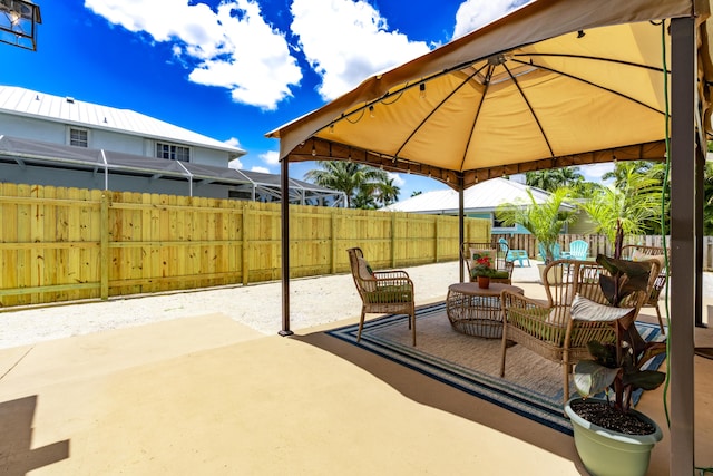 view of patio with a gazebo and a fenced backyard
