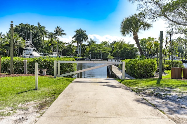 view of concrete surface featuring a water view