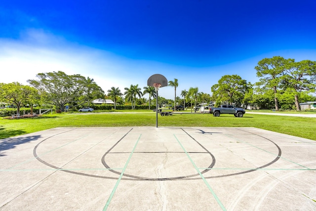 view of sport court featuring community basketball court and a yard