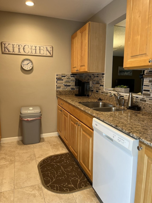 13852 Via Flora Unit A, Delray Beach, FL 33484 - kitchen with dishwasher, a sink, decorative backsplash, baseboards, and recessed lighting