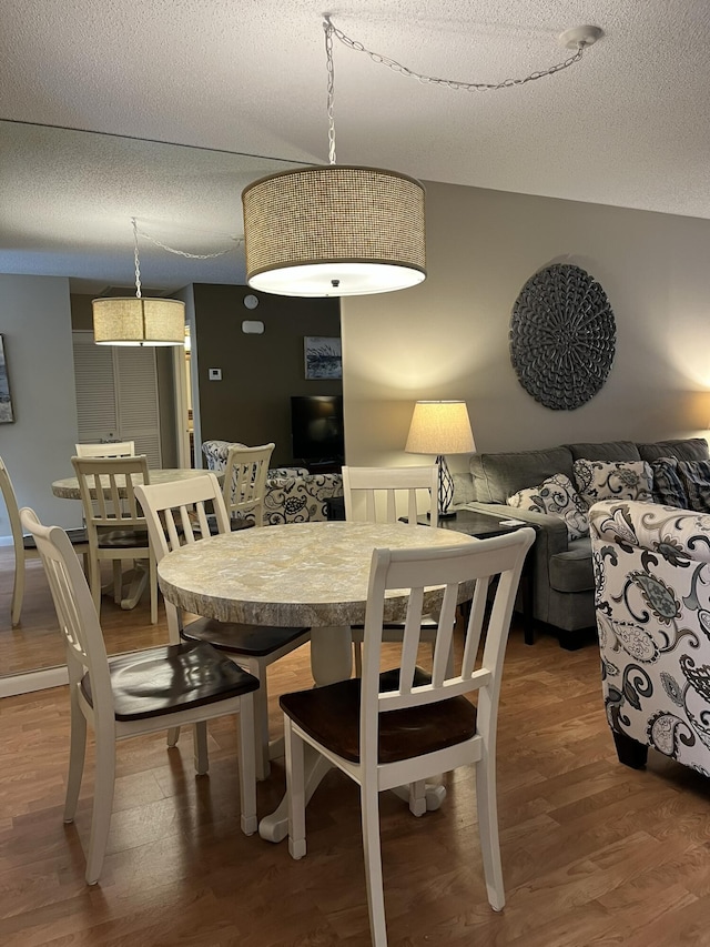 13852 Via Flora Unit A, Delray Beach, FL 33484 - dining area with wood finished floors and a textured ceiling