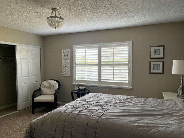 13852 Via Flora Unit A, Delray Beach, FL 33484 - carpeted bedroom with a closet and a textured ceiling