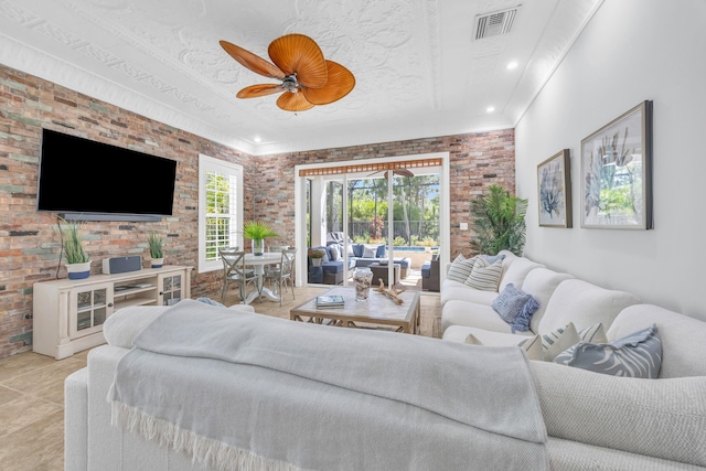 1909 Flower Dr, Palm Beach Gardens, FL 33410 - living area featuring brick wall, ceiling fan, and light tile patterned floors