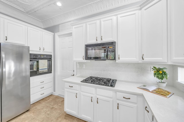 1909 Flower Dr, Palm Beach Gardens, FL 33410 - kitchen featuring black appliances, light countertops, white cabinetry, and light tile patterned floors