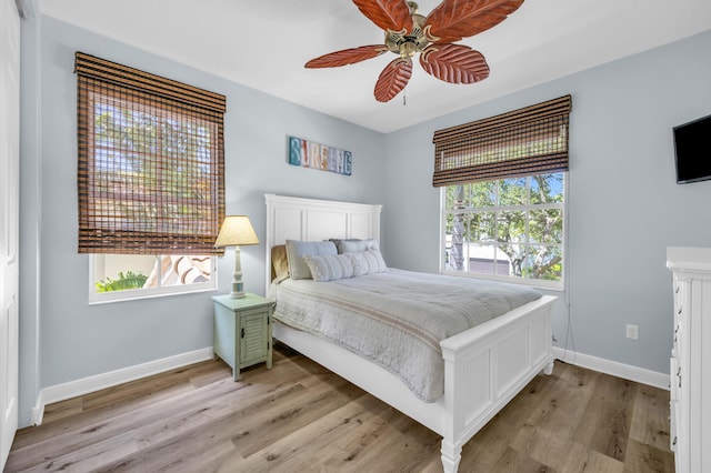 1909 Flower Dr, Palm Beach Gardens, FL 33410 - bedroom featuring light wood-style floors and ceiling fan