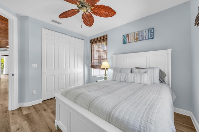 1909 Flower Dr, Palm Beach Gardens, FL 33410 - bedroom featuring light wood-style floors, ceiling fan, and a closet