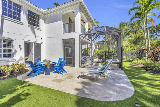 1909 Flower Dr, Palm Beach Gardens, FL 33410 - patio / terrace with a patio, glass enclosure, and an outdoor fire pit