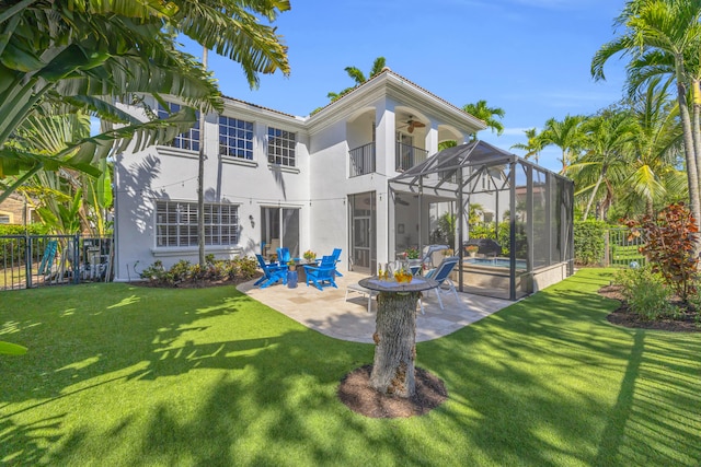 1909 Flower Dr, Palm Beach Gardens, FL 33410 - rear view of property featuring a balcony, stucco siding, a patio area, ceiling fan, and a swimming pool