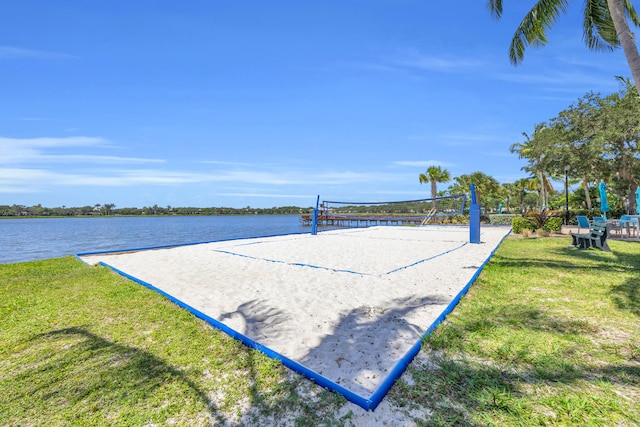 1909 Flower Dr, Palm Beach Gardens, FL 33410 - surrounding community with volleyball court, a lawn, and a water view