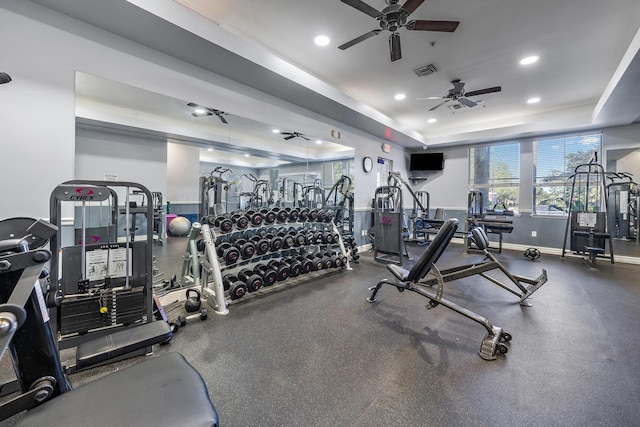 1909 Flower Dr, Palm Beach Gardens, FL 33410 - exercise room featuring a ceiling fan, recessed lighting, and a tray ceiling