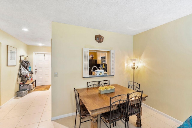 2890 SW 22nd Cir Unit 242B, Delray Beach, FL 33445 - dining space featuring tile patterned floors, a textured ceiling, baseboards, and recessed lighting