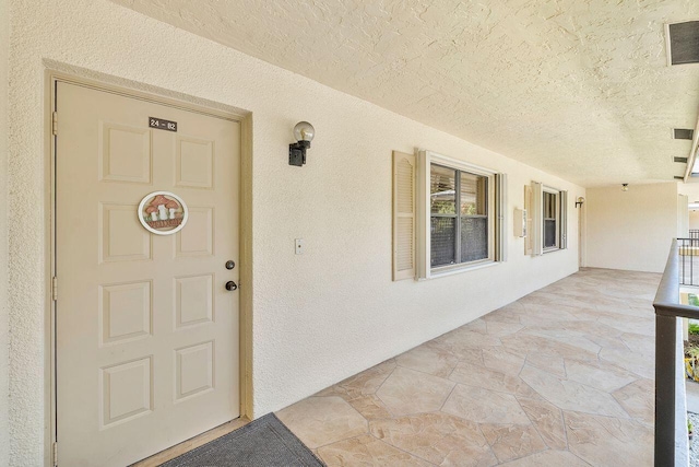 2890 SW 22nd Cir Unit 242B, Delray Beach, FL 33445 - doorway to property featuring stucco siding