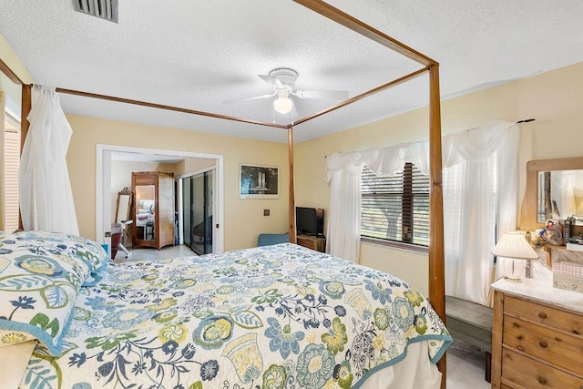 2890 SW 22nd Cir Unit 242B, Delray Beach, FL 33445 - bedroom with a textured ceiling and a ceiling fan