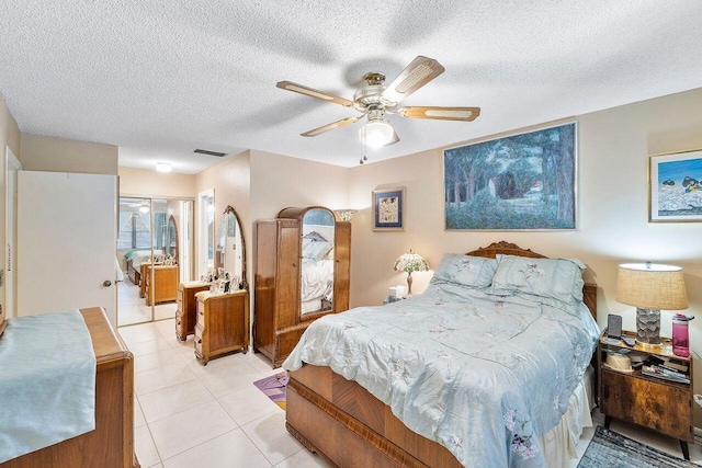 2890 SW 22nd Cir Unit 242B, Delray Beach, FL 33445 - bedroom with a textured ceiling, light tile patterned floors, and ceiling fan