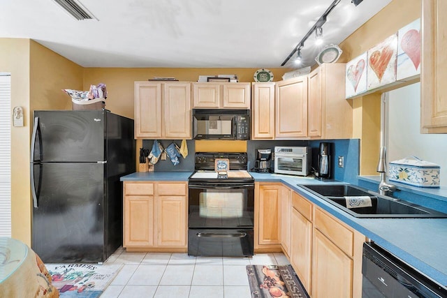 2890 SW 22nd Cir Unit 242B, Delray Beach, FL 33445 - kitchen with black appliances, light brown cabinetry, a sink, and light tile patterned floors