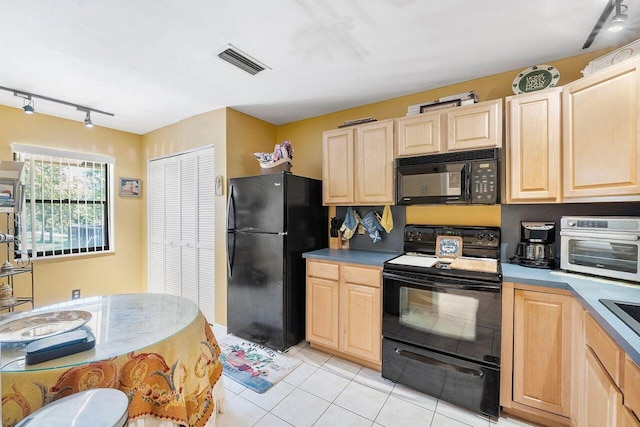 2890 SW 22nd Cir Unit 242B, Delray Beach, FL 33445 - kitchen featuring black appliances, light brown cabinetry, light tile patterned floors, rail lighting, and a sink
