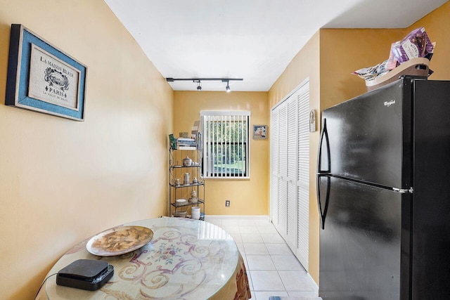 2890 SW 22nd Cir Unit 242B, Delray Beach, FL 33445 - dining area featuring rail lighting and light tile patterned flooring