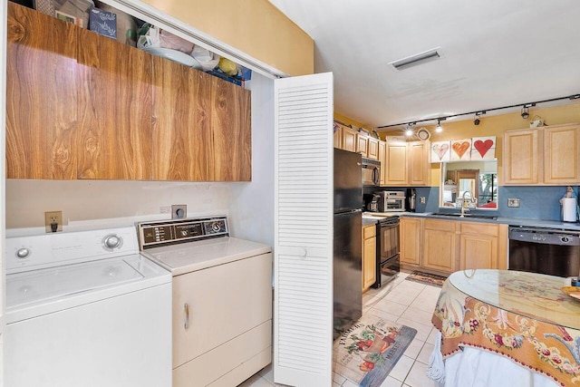 2890 SW 22nd Cir Unit 242B, Delray Beach, FL 33445 - kitchen with black appliances, washing machine and clothes dryer, a sink, and light brown cabinets