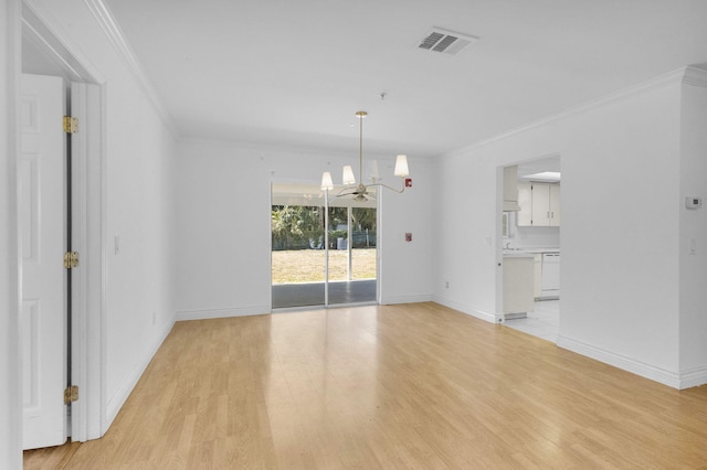 8888 SE Colony St, Hobe Sound, FL 33455 - empty room featuring a chandelier, crown molding, light wood-style flooring, and baseboards