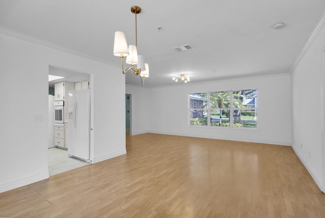 8888 SE Colony St, Hobe Sound, FL 33455 - empty room with light wood-style flooring, ornamental molding, baseboards, and a chandelier