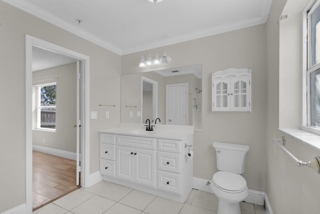 8888 SE Colony St, Hobe Sound, FL 33455 - bathroom with ornamental molding, toilet, baseboards, vanity, and tile patterned flooring