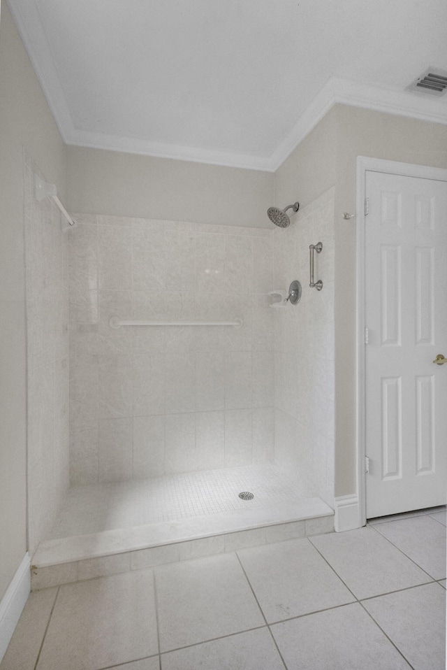 8888 SE Colony St, Hobe Sound, FL 33455 - full bathroom featuring ornamental molding, a tile shower, tile patterned floors, and baseboards