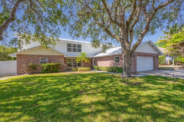 8888 SE Colony St, Hobe Sound, FL 33455 - traditional home featuring an attached garage, brick siding, and driveway