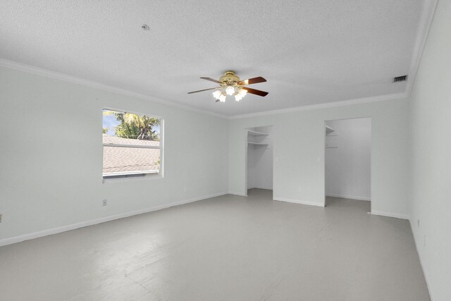 8888 SE Colony St, Hobe Sound, FL 33455 - unfurnished bedroom featuring crown molding, baseboards, a textured ceiling, and a ceiling fan