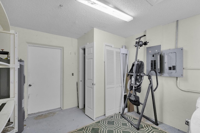 8888 SE Colony St, Hobe Sound, FL 33455 - workout room with electric panel and a textured ceiling