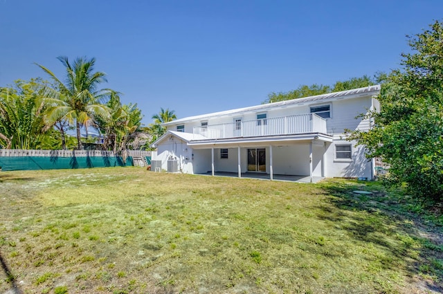 8888 SE Colony St, Hobe Sound, FL 33455 - back of property with a patio and central AC