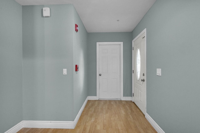 8888 SE Colony St, Hobe Sound, FL 33455 - corridor with light wood-style floors and baseboards