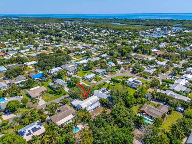 8888 SE Colony St, Hobe Sound, FL 33455 - aerial overview of property's location featuring a nearby body of water and nearby suburban area