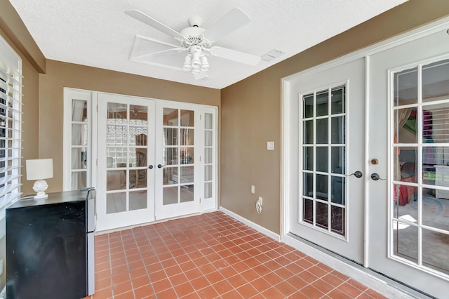 unfurnished sunroom with french doors