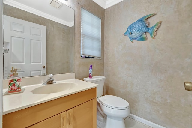 half bath featuring toilet, vanity, crown molding, and baseboards