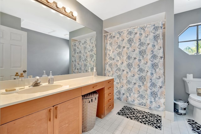 full bath with toilet, tile patterned floors, vanity, and curtained shower