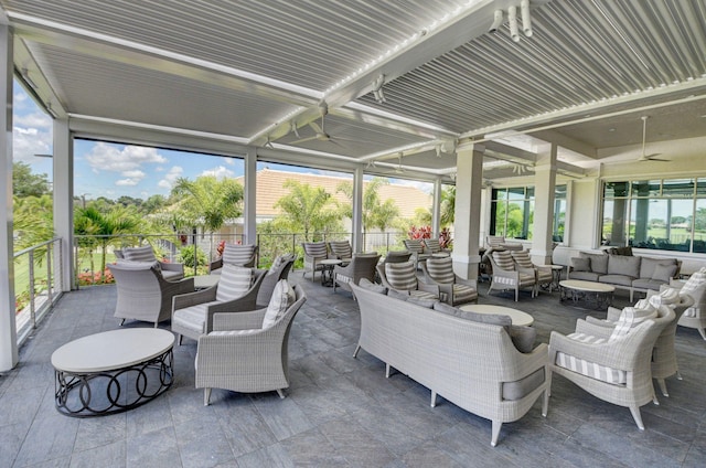 view of patio / terrace featuring a ceiling fan, an outdoor hangout area, and fence
