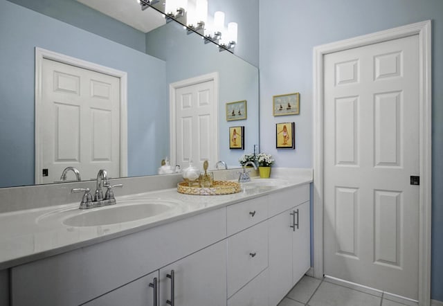 bathroom featuring tile patterned floors and double vanity