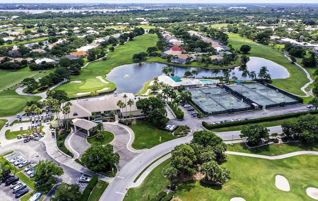 aerial overview of property's location featuring a golf club and a nearby body of water