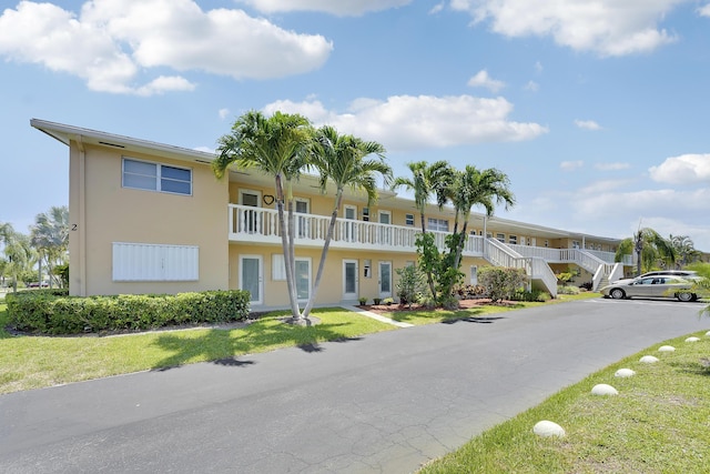 2151 NE 1st Ct Unit 102, Boynton Beach, FL 33435 - view of property with stairs