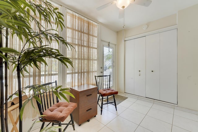 2151 NE 1st Ct Unit 102, Boynton Beach, FL 33435 - living area featuring a ceiling fan and light tile patterned flooring