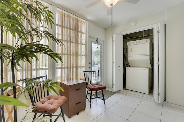 2151 NE 1st Ct Unit 102, Boynton Beach, FL 33435 - living area with stacked washer and clothes dryer, a ceiling fan, and light tile patterned floors