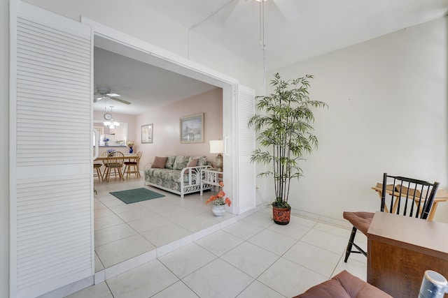 2151 NE 1st Ct Unit 102, Boynton Beach, FL 33435 - tiled living area featuring a ceiling fan