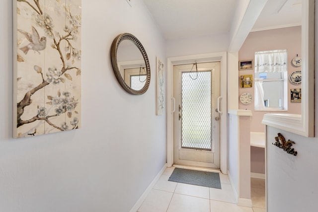 2151 NE 1st Ct Unit 102, Boynton Beach, FL 33435 - doorway to outside featuring baseboards and light tile patterned flooring